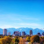 views of salt lake city from west valley city with snow capped wasatch mountains in the background