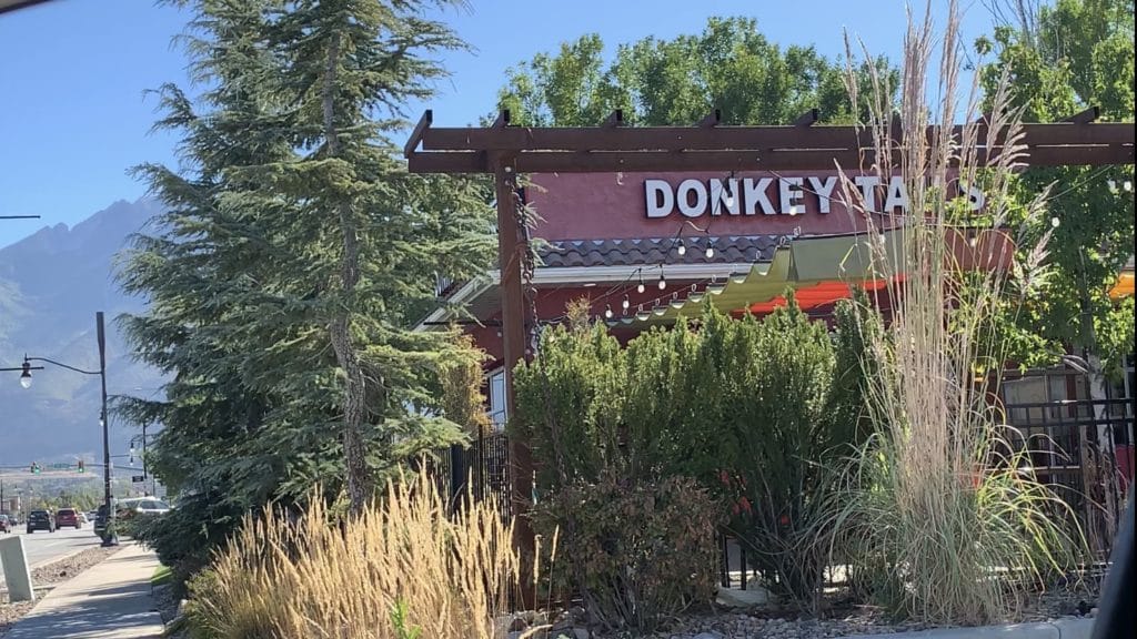 to show the exterior courtyard of donkeytails cantina in draper utah from the parking lot